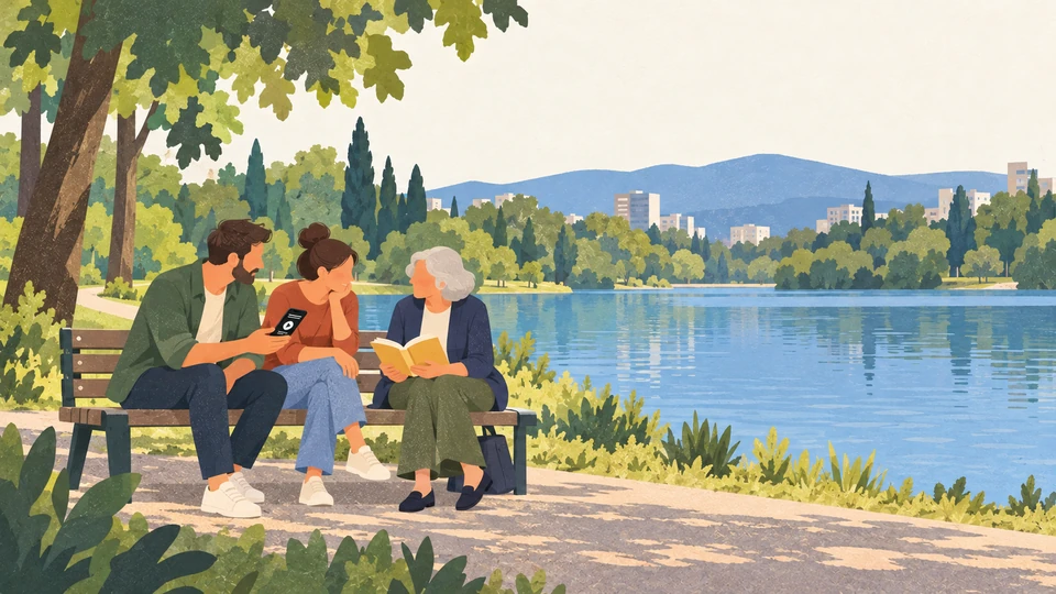 Three people share a book and an audio recording beside the lake in Tirana’s Grand Park.